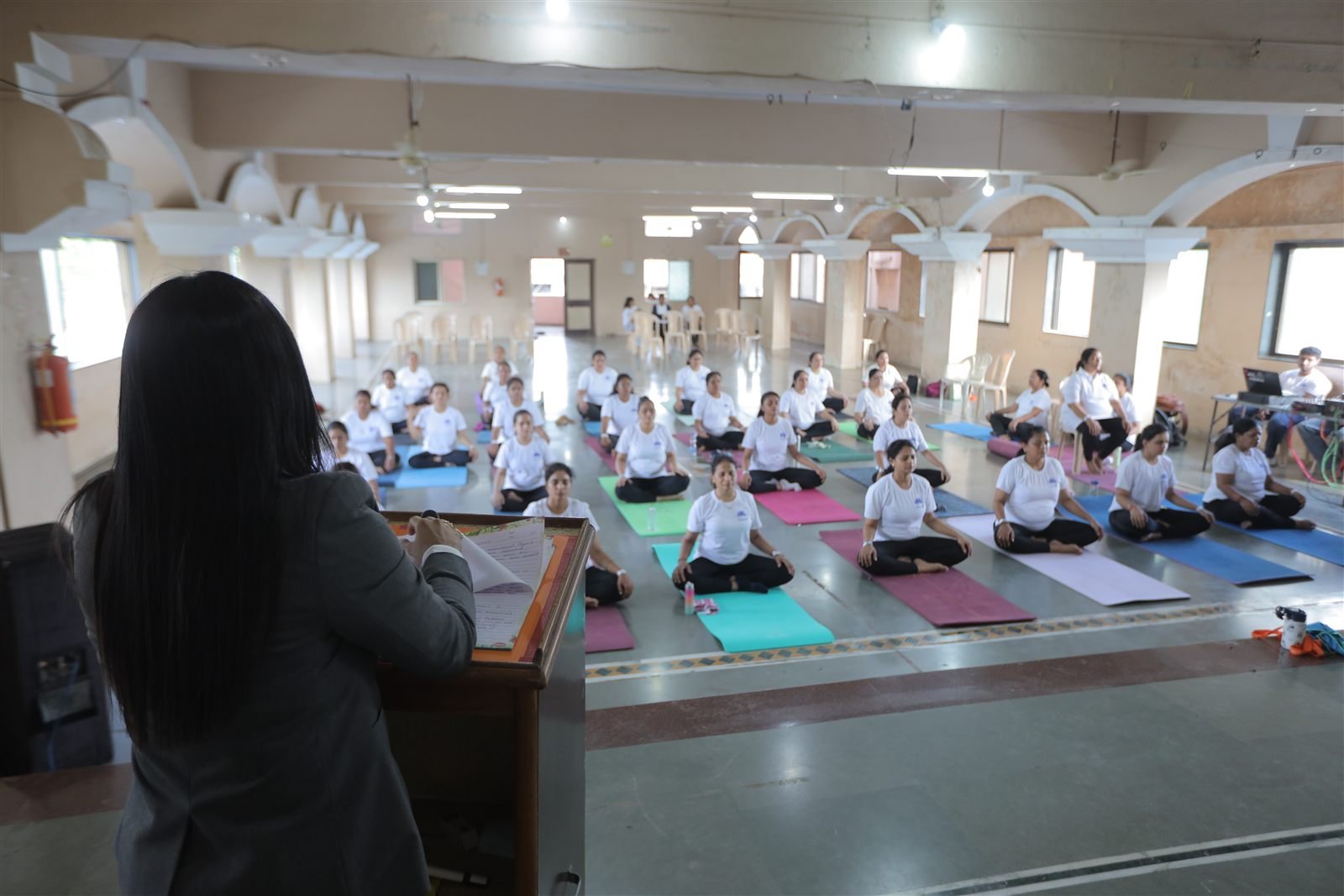 Roshni Rajput leading a full yoga hall in Bansda